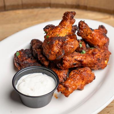 Buffalo chicken wings served with dipping sauce.