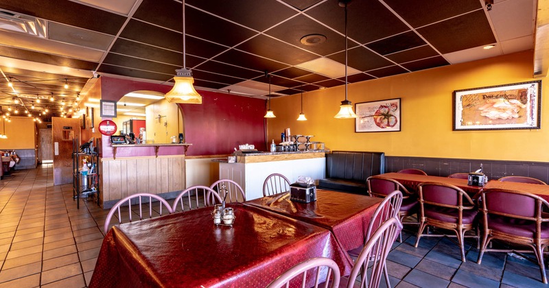 A table and a checkout counter behind