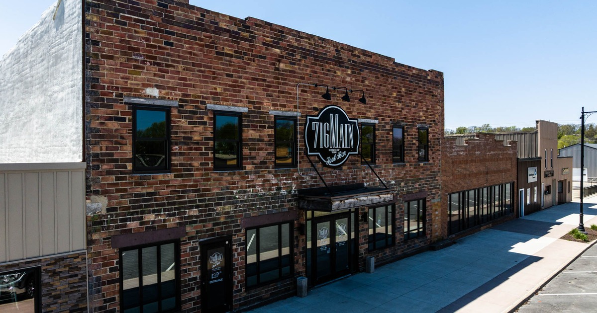 Exterior, brick building with 716 Main sign above the entrance