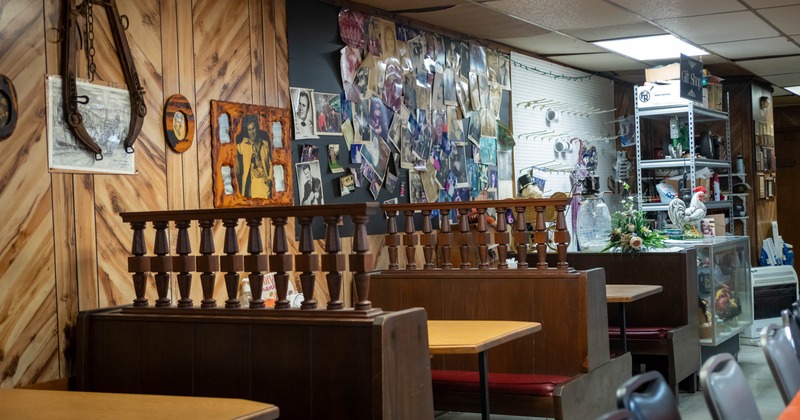 Interior of a rustic diner with wooden booths and vintage decorations