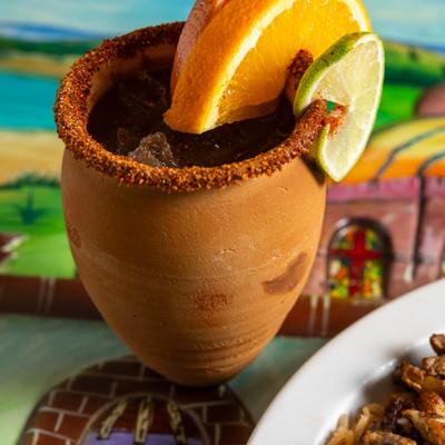 Cocktail in a clay cup.