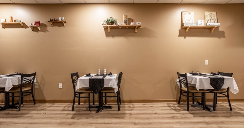 Interior, tables and chairs near wall