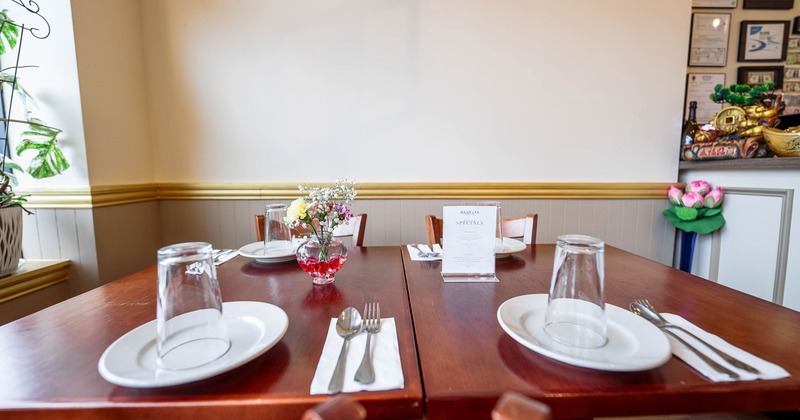 Dining table set for four guests, close up