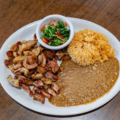 Tripe plate with refried beans, rice, and pico de gallo.