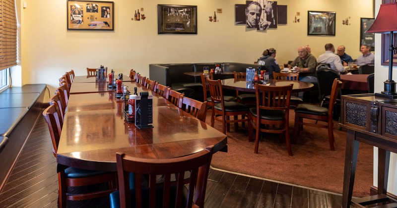 Interior, dining tables, guests chatting