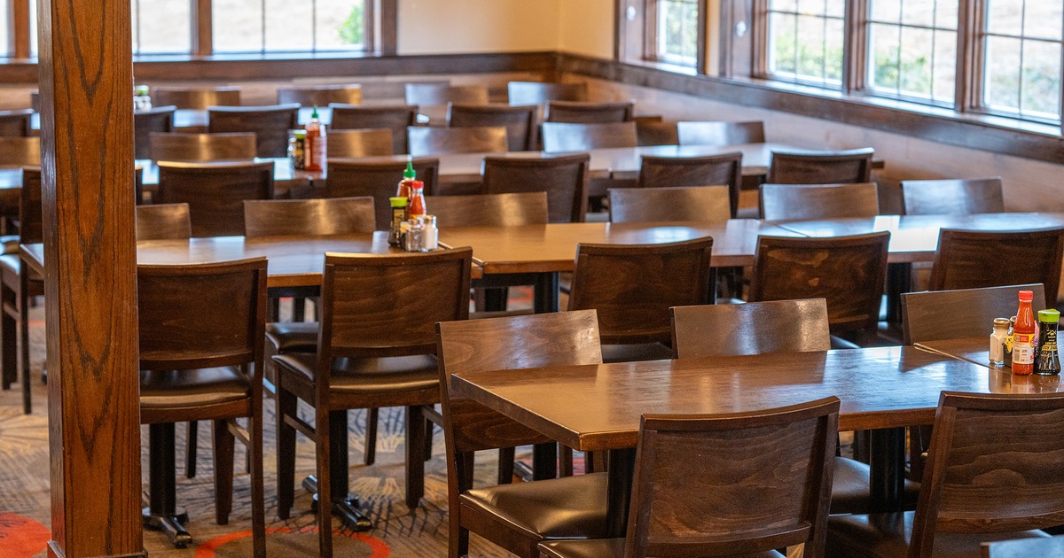Interior space, dining area, dining tables ready for guests