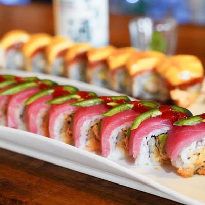 Two types of sushi rolls served on a white plates.