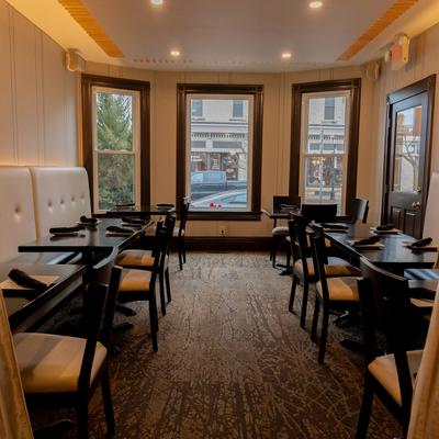 Interior, cozy dining room with set dining tables suitable for smaller private parties.