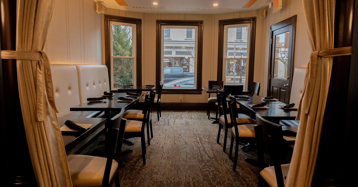 Restaurant interior, cozy dining area with set dining tables suitable for smaller private parties