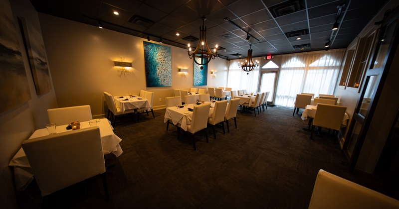 Specious and cozy private dining room with set tables