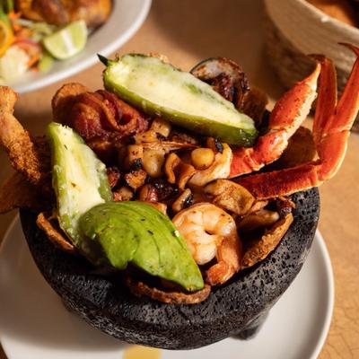 Molcajete Mi General served in a hot lava rock bowl.