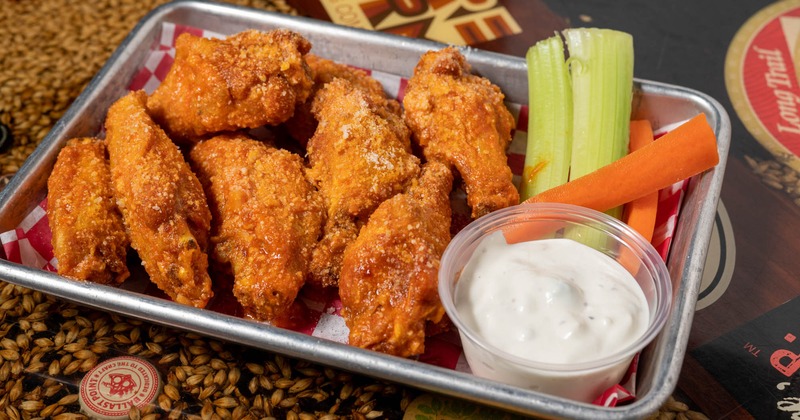 Classic Jumbo Wings served with sauce, celery, and carrots