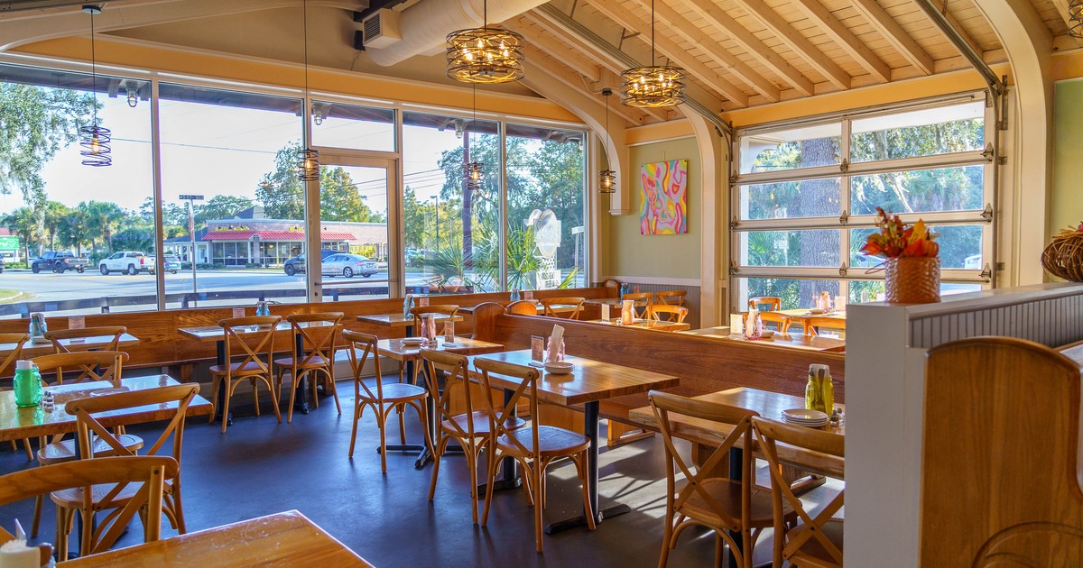 Interior, tables and chairs in dining area