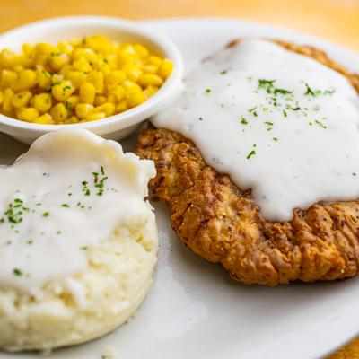 Chicken Fried Steak, mashed potatoes and buttered corn on the side.