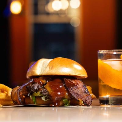 Bourbon BBQ Burger, with bacon, crispy onion straws, lettuce, pickles, and cheddar.