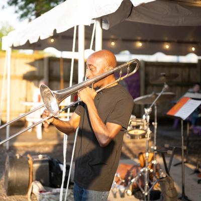 Patio, a trombonist playing with a brass band.
