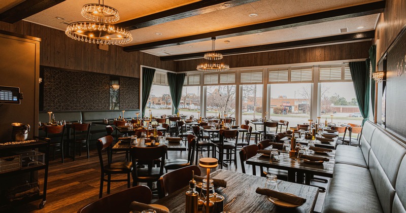 Interior, dining area, large window area, tables and chairs ready for guests