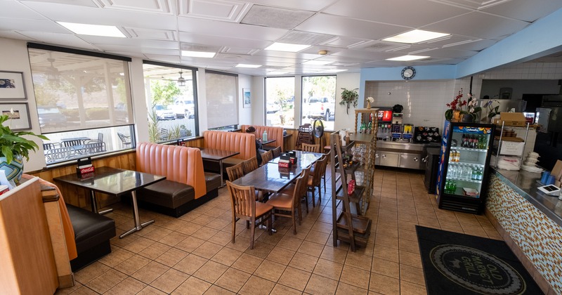 Bright diner with tan booths and large windows