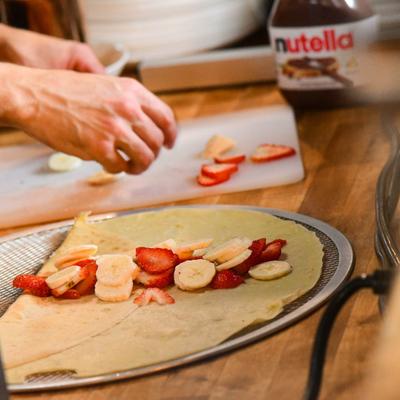 Strawberry Banana Crepe being assembled.