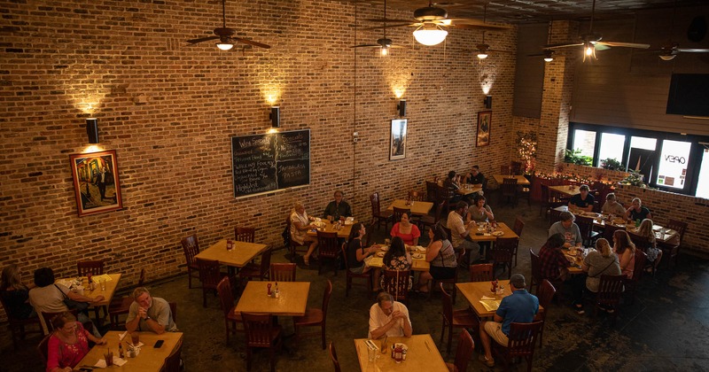 Interior, upstairs, view of the dining area with guests