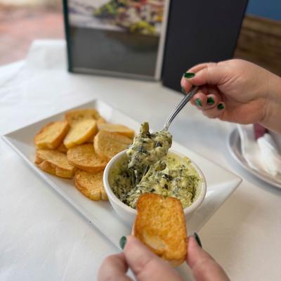 Hands holding food.