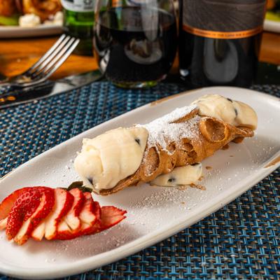 Cannoli with chocolate chips and sliced strawberry.