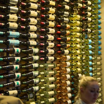 Wall display of wine bottles in the restaurant.