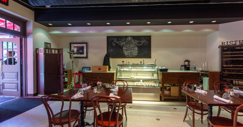 Interior, front desk,  dining tables ready for guests