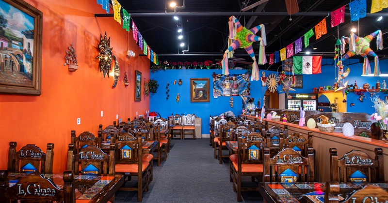 Interior seating area with chairs and tables, colorful decoration