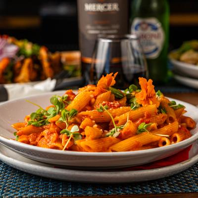 Penne pasta in pink vodka sauce.