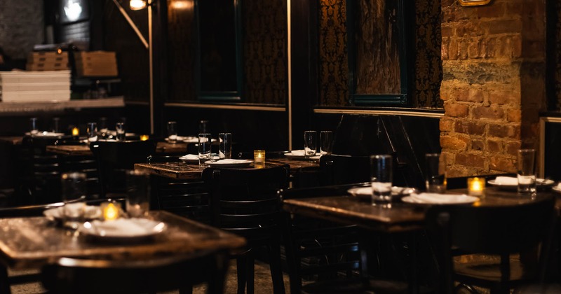 Interior, dining area with tables set for guests