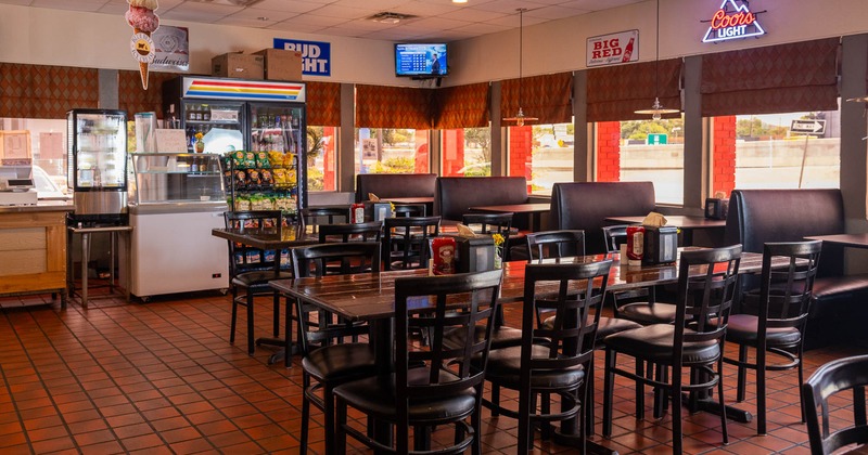 Interior, tables and chairs in dining area