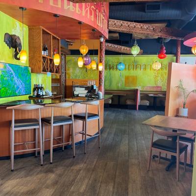 Bar area with colorful hanging lights.