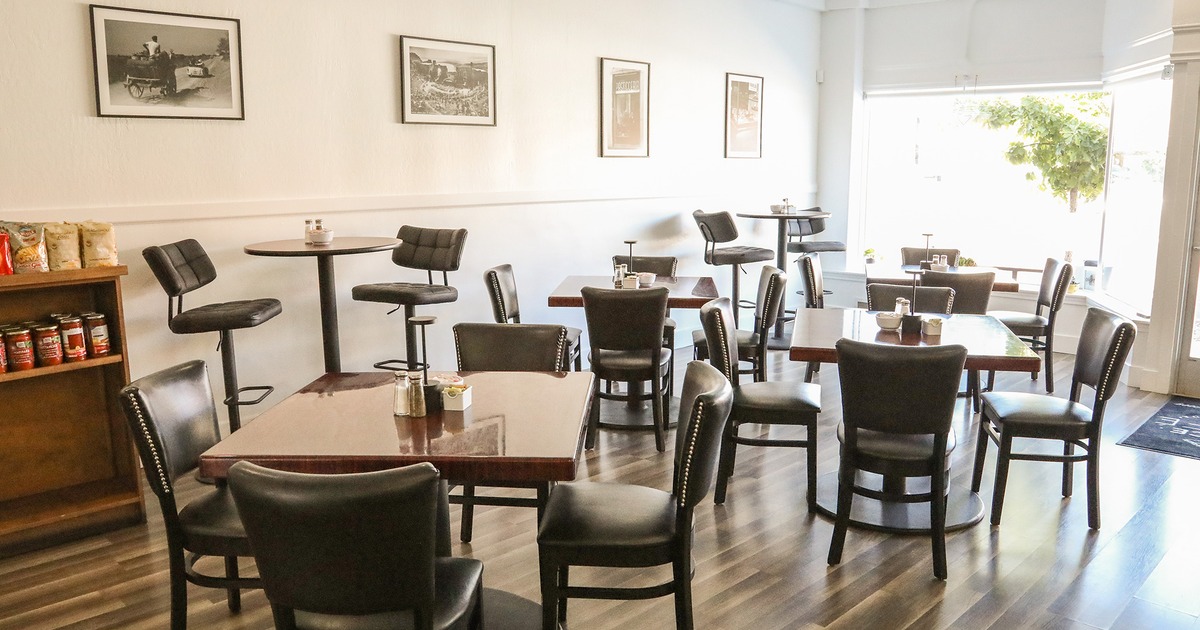 Interior space, dining area, tables ready for guests