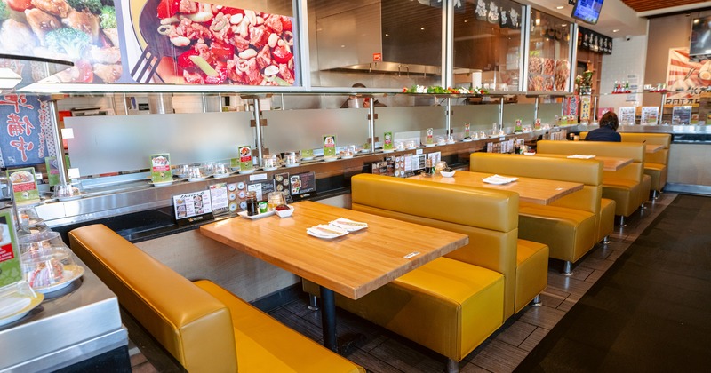 Cozy Japanese-style interior dining area with upholstered booths