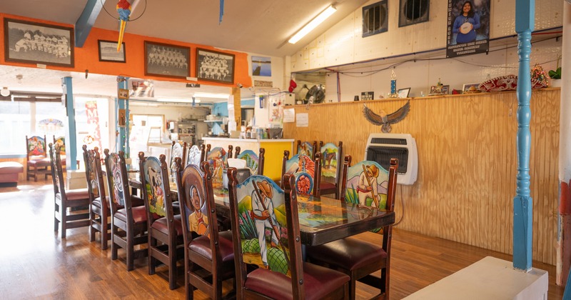 Dining space with colorful chairs and tables