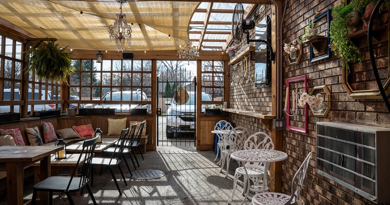 Patio, dining area with tables and chairs ready for guests