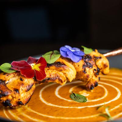 Smoked chicken, signature red pepper tomato sauce and curry