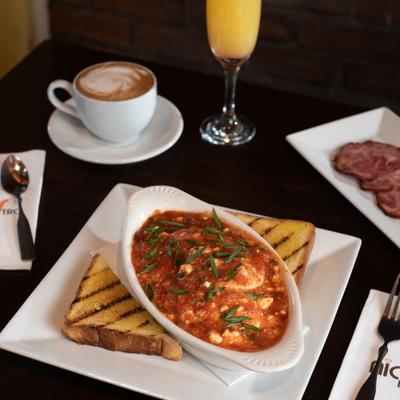 Chicken Parmigiana, served with toast.