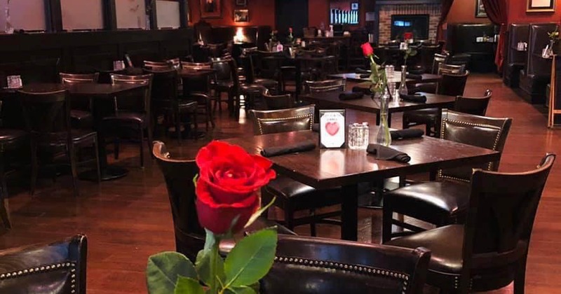 Interior, tables with a red rose as decoration