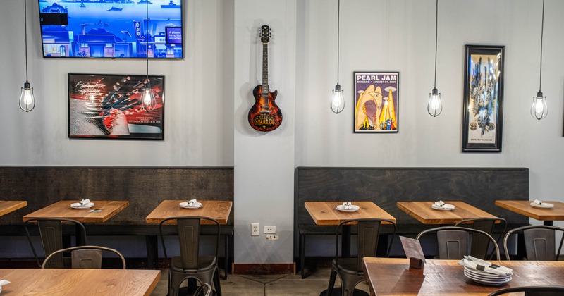 Interior with tables and wooden benches beside the wall