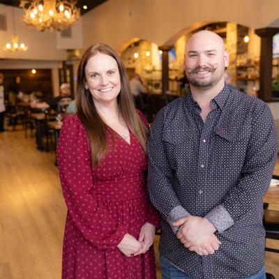 Two people posing inside the restaurant.