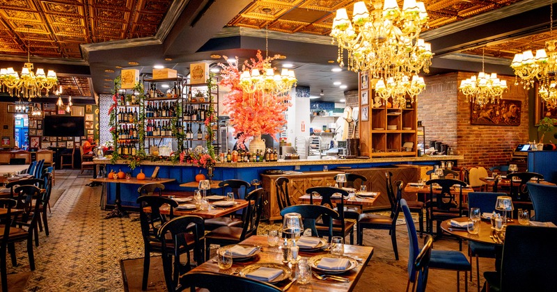 Diner and bar area, tables and chairs, bar  behind