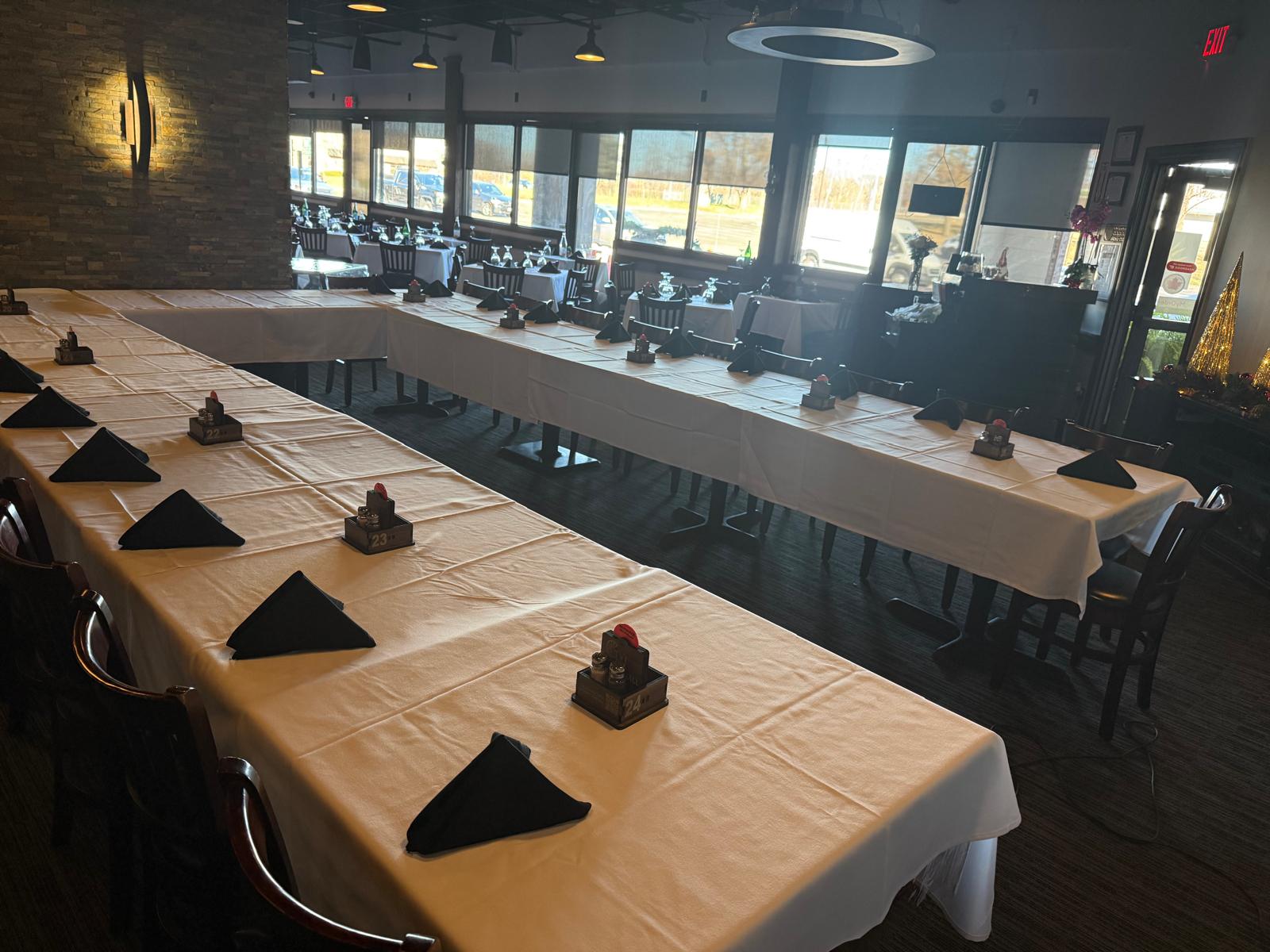 Interior - tables ready for guests, pictures on the wall