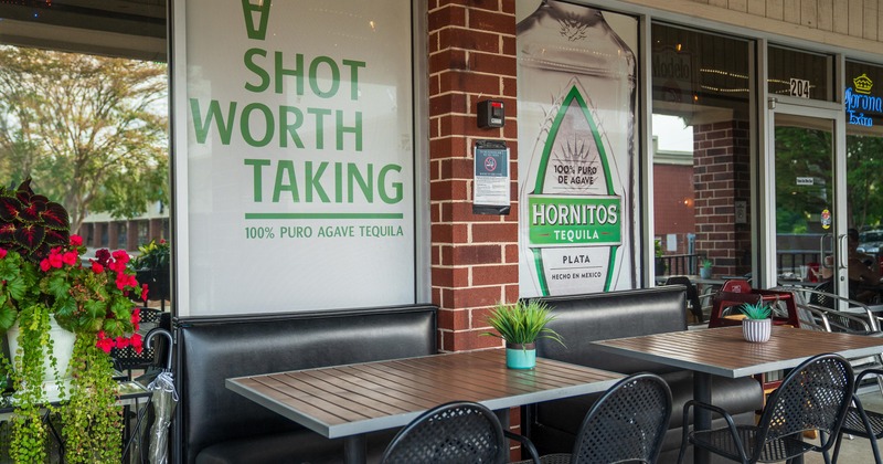 Outdoor seating area in front of the restaurant entrance