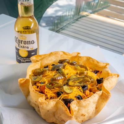 Joe’s Famous Rice Bowl paired with a bottle of Mexican beer.