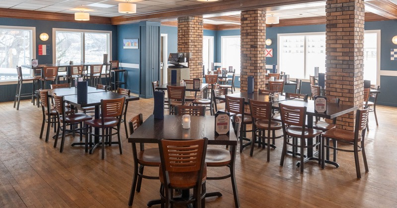 Interior, seating area with  wooden  tables and chairs