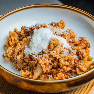 Campanelle pasta with beef ragu, horseradish cream, and parmesan.