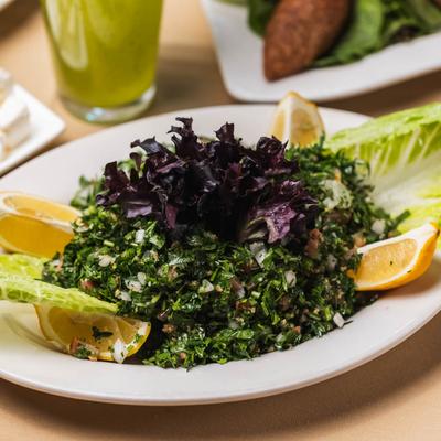 Salad with cracked wheat, parsley, onion, tomato, lemon juice, and olive oil.