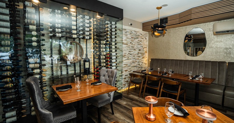 Interior, dining area, banquette bench with tables, tables for four and two